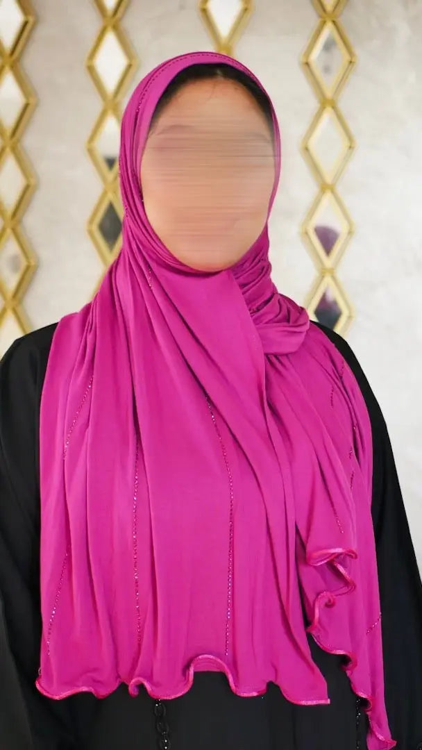 <img src="hijab-jawahir-argent.jpg" alt="Hijab Jawahir avec strass argentés - Une touche brillante et élégante">
<img src="hijab-jawahir-details.jpg" alt="Détails des strass du Hijab Jawahir - Raffinement et éclat">
<img src="hijab-jawahir-jersey.jpg" alt="Hijab Jawahir en jersey coton - Confort et style luxueux">
<img src="collection-jawahir.jpg" alt="Collection Hijab Jawahir par JH Scarf - Un accessoire chic et raffiné">